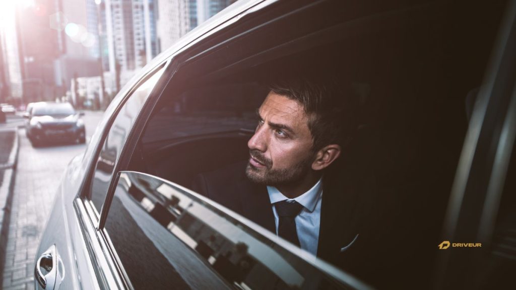 Business travel in Italy privar car and driver, man ain a luxury car